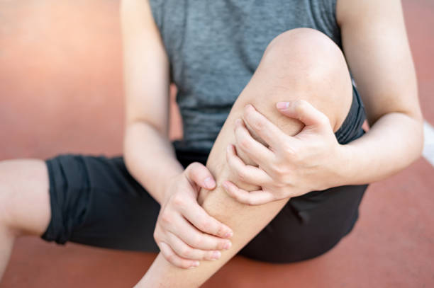 istock Athlete man suffering from leg and knee pain 1410202996
