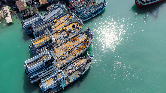 Aerial view of fisherman dock which has many ships anchoring for transport seafood and supplies on island of Songkhla, Thailand