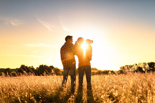 Happy family at sunset.