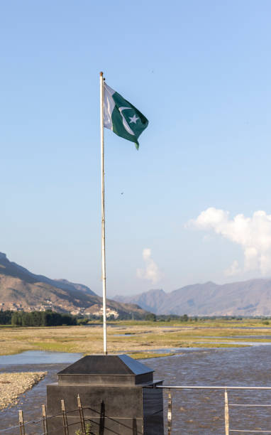 istock Pakistan flag with a beautiful scenery background 1410206415