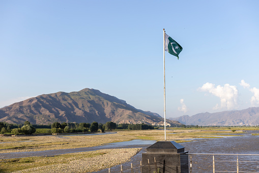 Pakistan flag with a beautiful scenery and selective focus