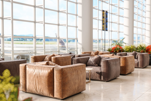 Close-up View Of Leather Armchairs In Airport Lounge