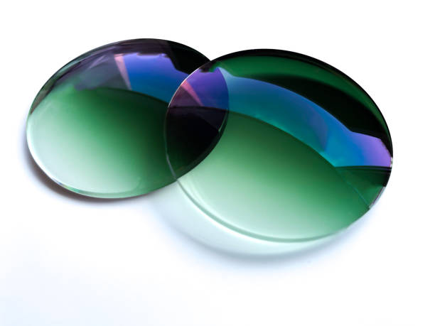 istock Two green gradient sun protection plastic eyeglass lens on white background. 1410211632