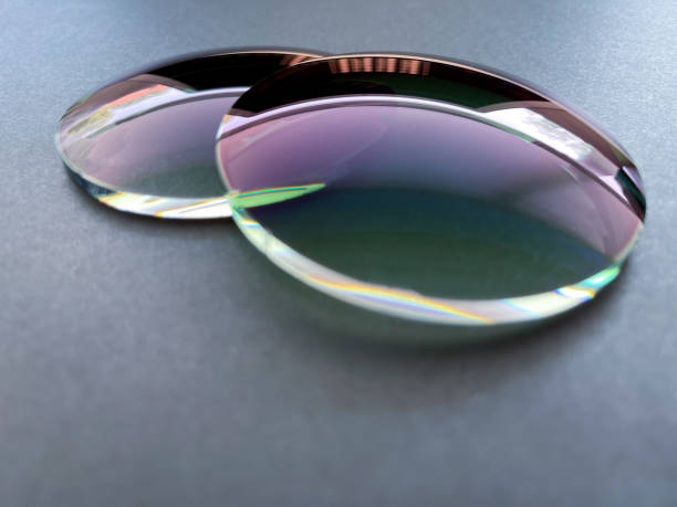 two green gradient sun protection plastic eyeglass lens on black background. - tinted sunglasses imagens e fotografias de stock