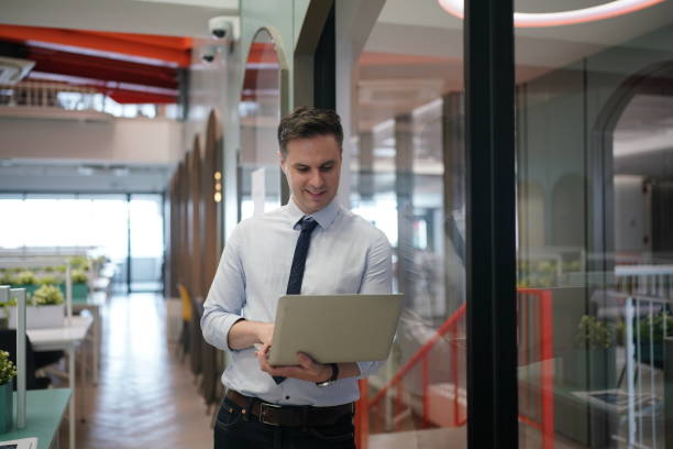 istock businessman using laptop in office. 1410213486