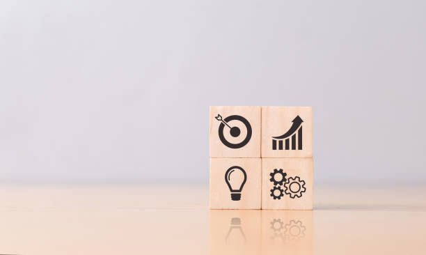istock Wooden cube with business icon. 1410213627