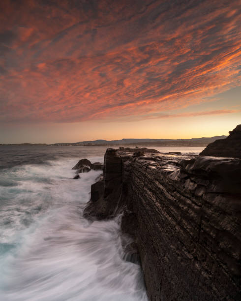 istock Rock wall by the sea 1410214601