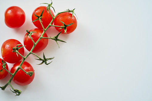 fresh cherry tomatoes in white background