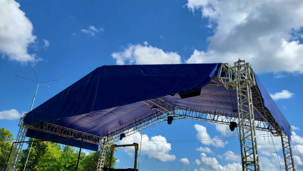 istock Summer stage in the park for events. Metal construction with a canopy. 1410220269