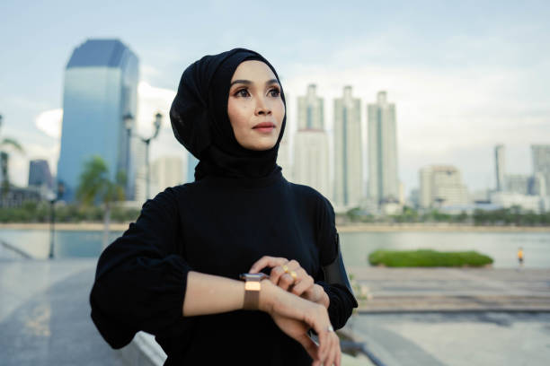 istock Muslim woman using technology measuring heart rate. 1410221753