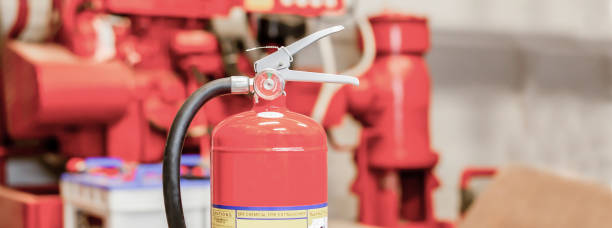 istock The red fire extinguisher is ready for use in case of an indoor fire emergency. 1410225045