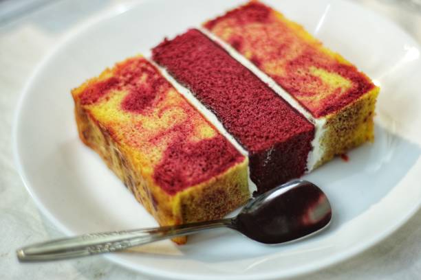 istock red velvet cake slices with spoon on white plate 1410225483