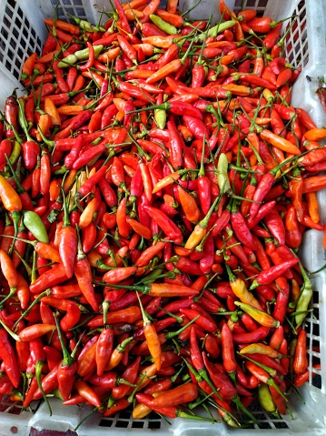 Top View Pile of Fresh Chili and Ripe Red Hot Chili in The Basket for Sale in The Vegetables Market of kanoman Traditional market