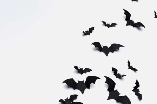 istock halloween and decoration concept - paper bats flying 1410229802