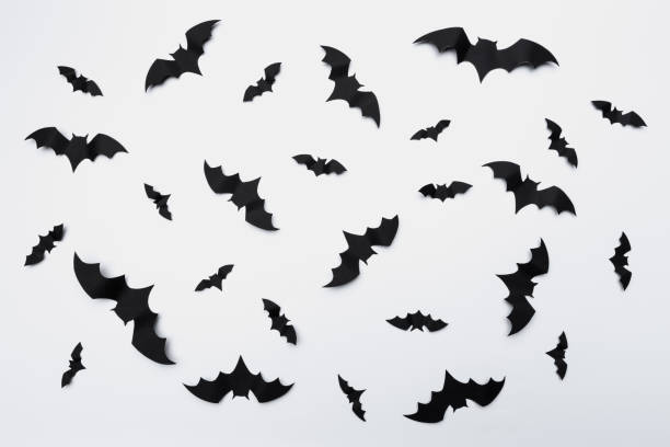 istock halloween and decoration concept - paper bats flying 1410230061