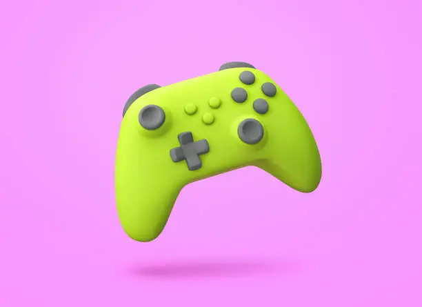 Photo of Green game controller isolated on purple background