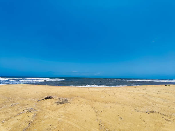 istock Beach sand near the sea under the blue sky 1410232927