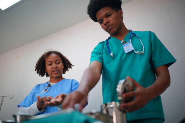 istock Medical Team Working On Patient In Emergency Room 1410233423