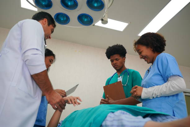 istock Medical Team Working On Patient In Emergency Room 1410233496