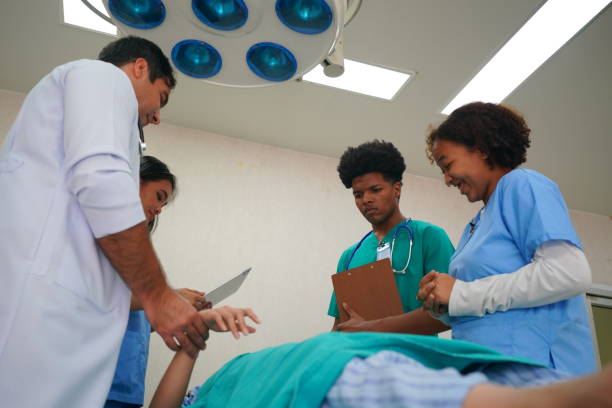 istock Medical Team Working On Patient In Emergency Room 1410233501