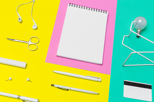 school supplies at colorful paper background
