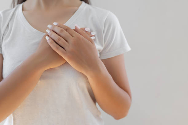 Woman hands checking her breast stock photo