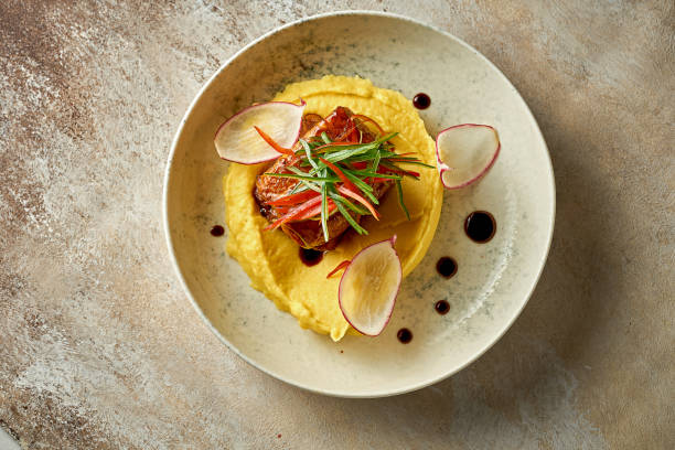 istock Catfish steak in sweet and sour sauce with mashed potatoes. Selective focus, close-up 1410236770