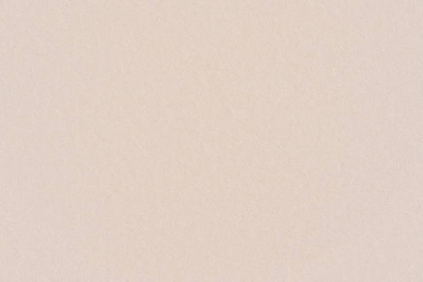 istock Light beige or pink color smooth cardboard paper, seamless tileable texture, image width 20cm 1410243753