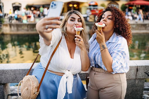 Females taking a selfie while eating ice cream