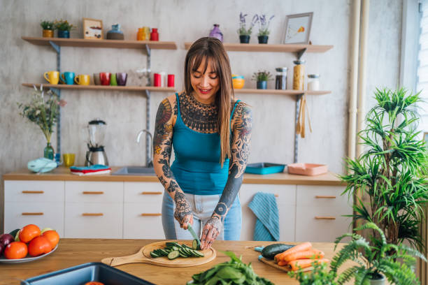 istock Woman preparing vegetable meal 1410247005