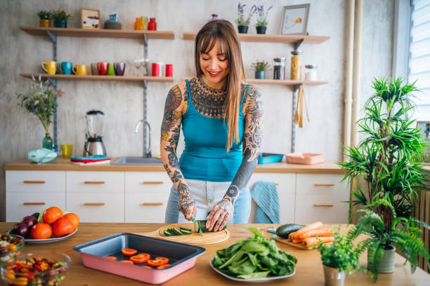 istock Woman preparing vegetable meal 1410247090
