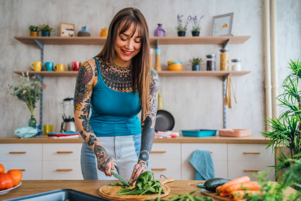 istock Woman preparing vegetarian meal in the kitchen 1410247132