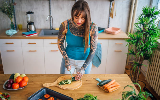 istock Woman preparing vegetarian meal in the kitchen 1410247151
