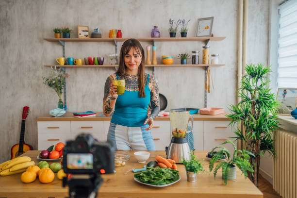 istock Young vlogger woman preparing a smoothie 1410248094