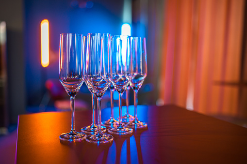 Close up of empty champagne glasses on a table.