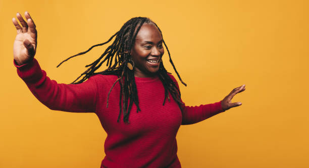 istock Happy black woman having fun in a studio 1410253327