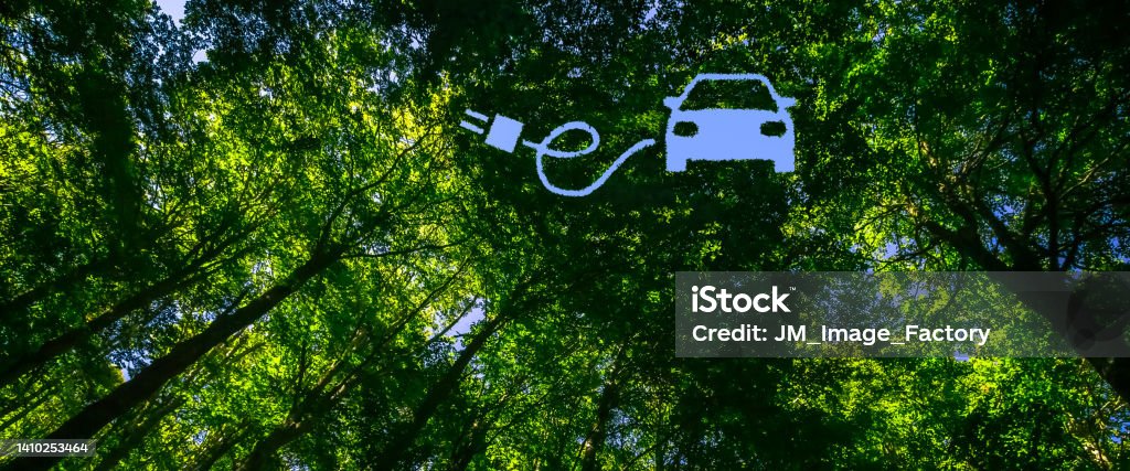 E-Mobility Concept Panoramic View into the Canopy of a Forest Combined with the Shape of an Electric Car, Cable and Plug Electric Car Stock Photo