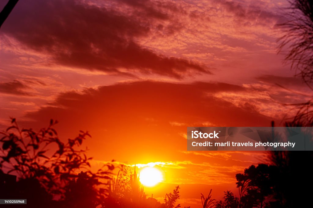 SUNSET Silhouetted sunset Cloud - Sky Stock Photo