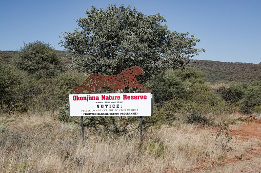 Sign to Okonjima AfriCat Foundation near Otjiwarongo at Otjozondjupa Region, Namibia. This is a safari lodge and rehabilitation centre for cheetahs.