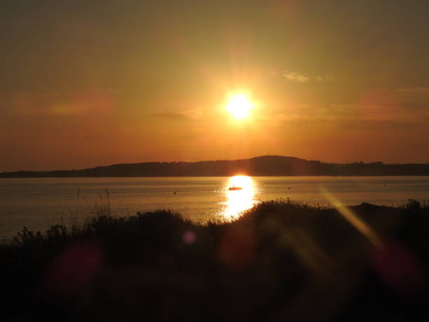 istock Sunset with fishing boat 1410260944