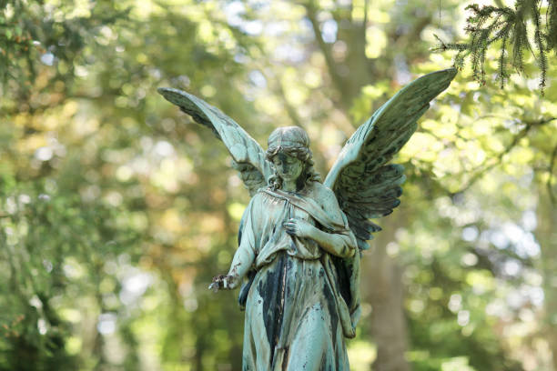 istock Antique Angel statue in a Cemetery 1410262188