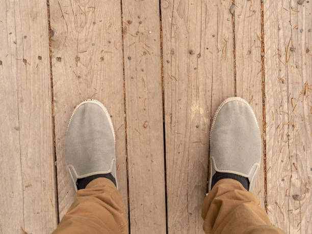 istock Feet on a wooden platform. 1410265060