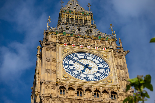The towers of The Houses of Parliament in Westminster, London, England.  They have recently been refurbished and have spent 3 years hidden behind scaffolding, the newly cleaned building is looking exceptionally bright.