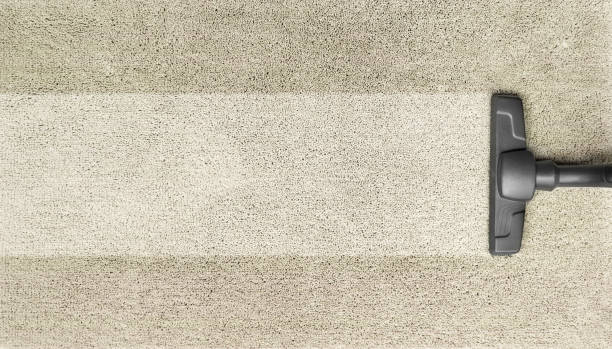 istock Cleaning the brown carpet with the vacuum cleaner 1410267245