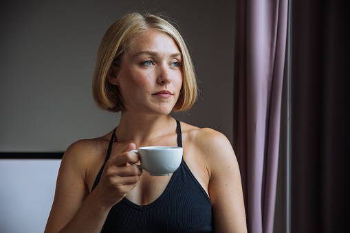 Beautiful woman relaxing and drinking hot tea