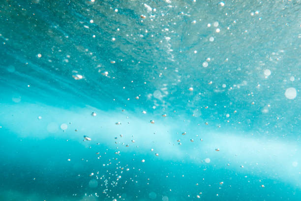 istock Underwater View of Bubbles In Deep Blue Sea. Close Up Water. Background 1410270058