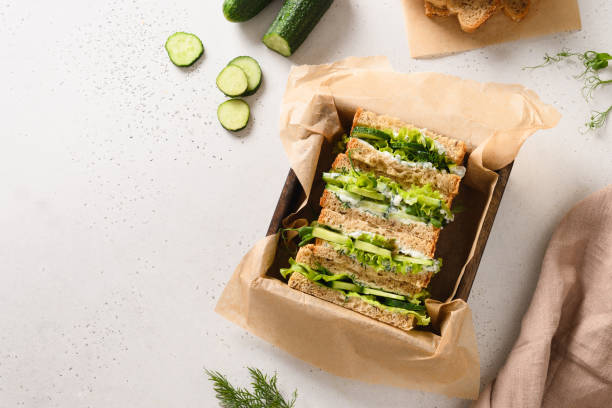 istock Cream cheese dill cucumber english tea sandwiches. toning. selective focus 1410270198