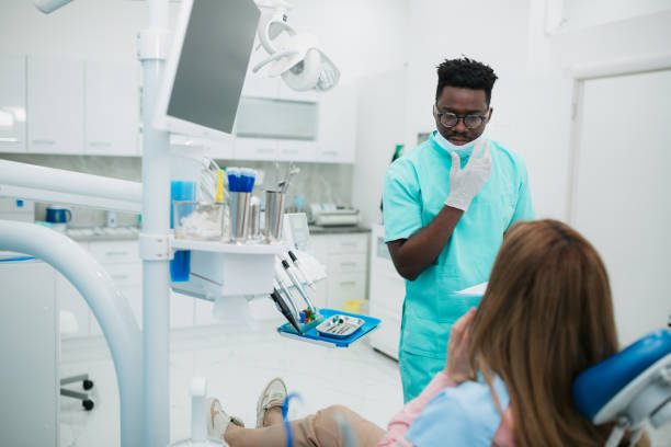 istock Complaining to the doctor about a toothache 1410271911