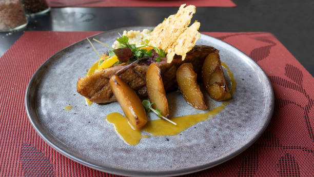 istock Roasted duck fillet with apple pieces and risotto 1410272715