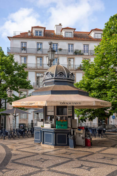 Lisbon, Portugal - May 22, 2022: Small shop in a town square in Lisbon at day.